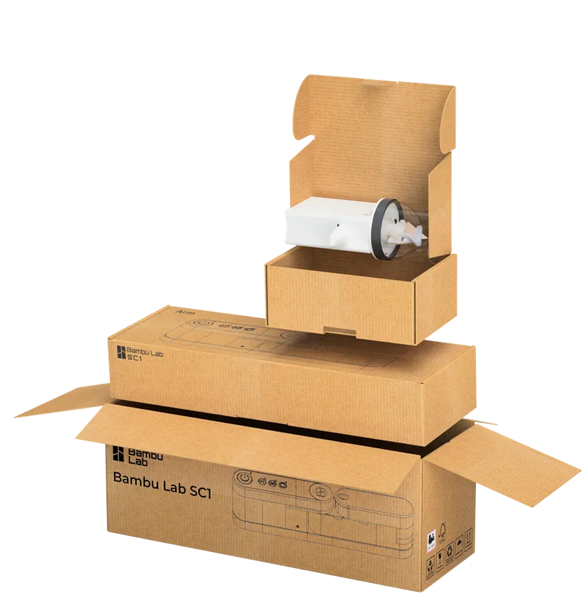 Render of the opened SC1 packaging: the main Bambu Lab SC1 box with the arm box stacked above it and the small cutting head box open at the top